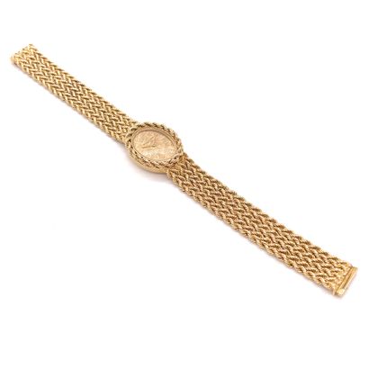 null BOUCHERON WATCH with gilded back and baton index. It presents a decoration and...