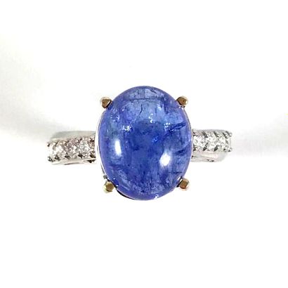 null RING set with a cabochon tanzanite of about 6.30 carats, the finger ring is...