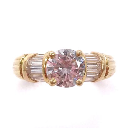 null RING set with a one-carat diamond, surrounded by baguette diamonds on both sides....