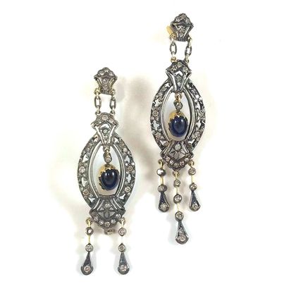 null PAIR OF EARRINGS with a geometrical design of a cabochon sapphire surrounded...
