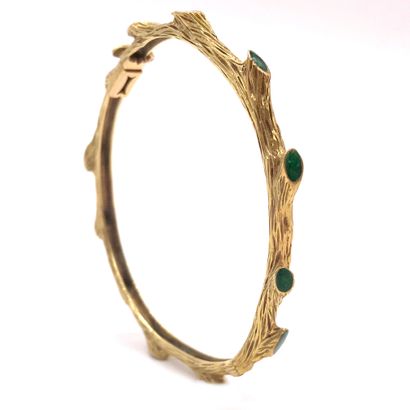 null 
BRACELET JONC

presenting a plant motif, decorated with a branch design holding...