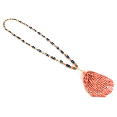 null HATCH adorned with a succession of angel skin coral, jade and agate beads. It...