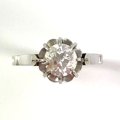 null 
SOLITAIRE RING
holding an old cut diamond of about 0.75 carat. Set in 18K white...