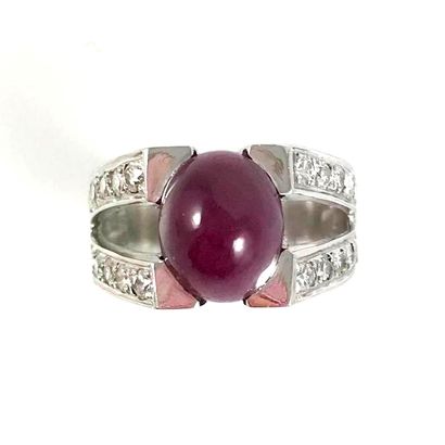 RING set with a cabochon ruby. Two lines...
