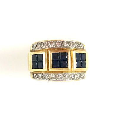 null RING presenting three squares of calibrated sapphire, surrounded by two lines...