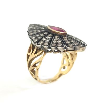 null A navette-shaped ring set with a navette ruby surrounded by brilliant-cut diamonds...