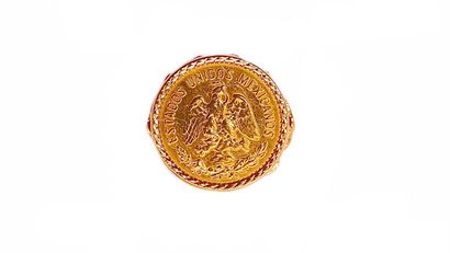 null RING decorated with a Mexican coin presenting on the obverse an eagle on a cactus...