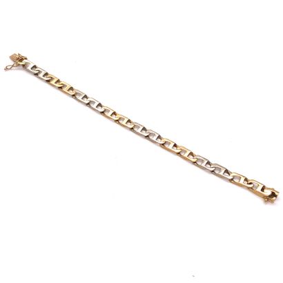 null BRACELET in curb chain. White gold and 18K yellow gold setting. Security clasp....
