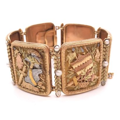 null BRACELET adorned with six elements with finely chiseled decoration, presenting...