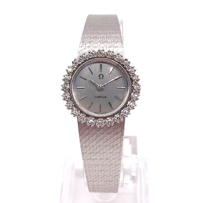 null OMEGA WATCH grey dial, baton hour markers, bezel set with brilliant-cut diamonds....