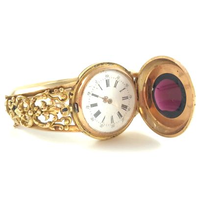 null 18K gold pocket watch, restored as a bracelet. Bracelet with a textured scroll...