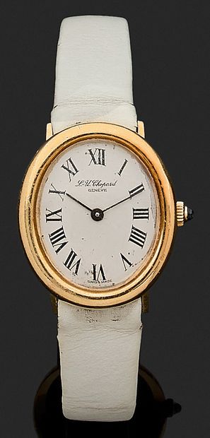 null CHOPARD WATCH with an oval dial in 18K yellow gold, white background, Roman...