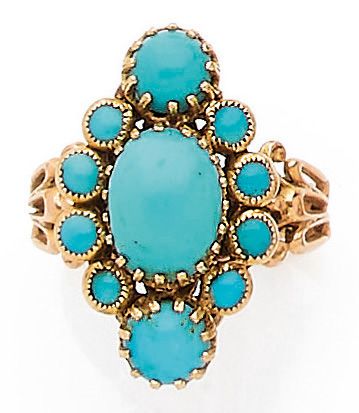 null BAGUE présentant une forme de losange ponctuée de cabochons de turquoise. Monture...