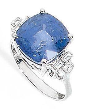 null IMPORTANT RING set with a sapphire, surrounded by three baguette diamonds on...
