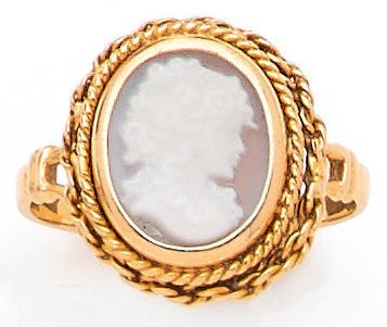 RING with a cameo showing a woman in profile....