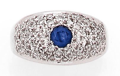 null RING set with a round sapphire, in a pavement of brilliant-cut diamonds. Mounted...