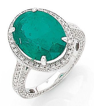 null IMPORTANT RING holding a 6.40 carat oval emerald, set with brilliant-cut diamonds....