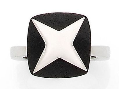 null MAUBOUSSIN RING "Divine Star" composed of an ebony pyramidal pattern, holding...