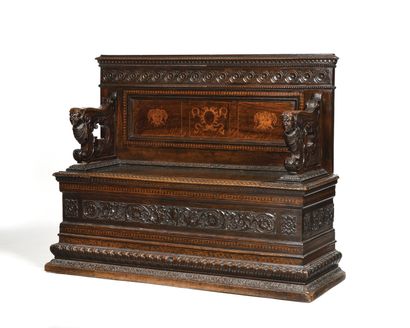 null CASSAPANCA in walnut carved with friezes, scrolls of flowers, fantastic animals,...