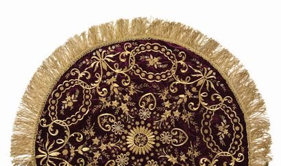null Circular crimson velvet embroidery decorated with a rich ornamentation of gold...