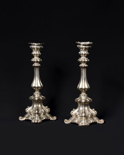 null PAIR OF silver FLAMPS standing on a quadripod base with foliage scrolls, decorated...