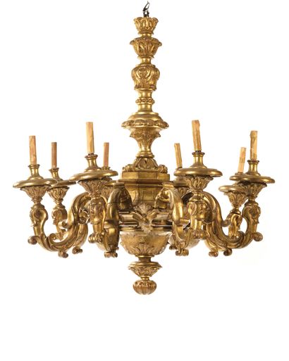 null A gilded wood chandelier with eight arms and foliage decoration (electrically...