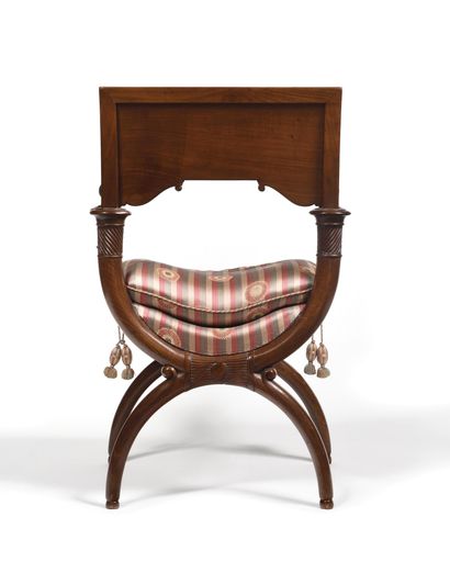 null TWO CURL CHAIRS FORMING HANGERS in mahogany, the rectangular "plank" back decorated...