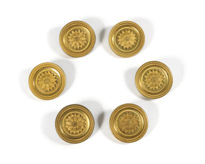 null A SET OF SIX round ormolu door knobs with a large laurel flower in the center....