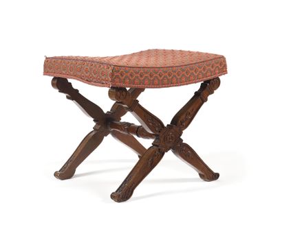 null Solid mahogany folding table carved with fleurons and stylized foliage. The...