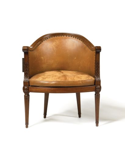 null A solid mahogany caned desk chair, moulded and carved, with a rounded back,...