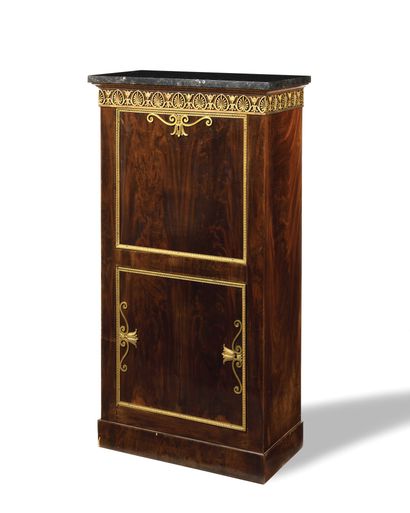 null A mahogany chest of drawers with a shelf and a chest and a flap opening to reveal...