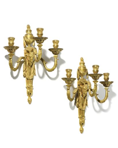 null A SET OF FOUR ormolu sconces with three branches and decoration of ram heads,...