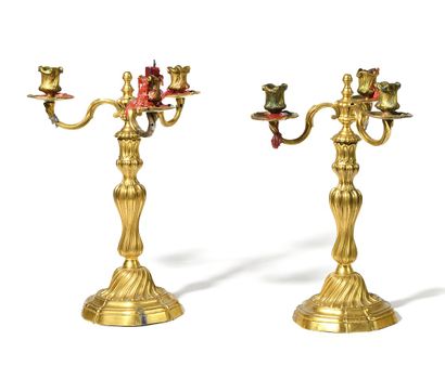 null A Pair of three-light gilt bronze CANDELABRES, the shaft in baluster resting...