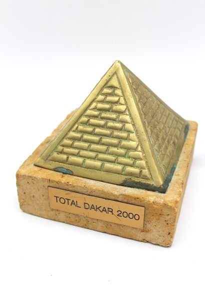 null Trophies Paris Dakar 2000- 2002

Trophy in the shape of an Egyptian Pyramid,...