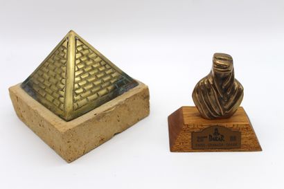null Paris Dakar 1998 and 2000 trophies

Trophy in the shape of an Egyptian Pyramid...