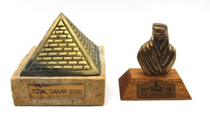 null Paris Dakar 1998 and 2000 trophies

Trophy in the shape of an Egyptian Pyramid...