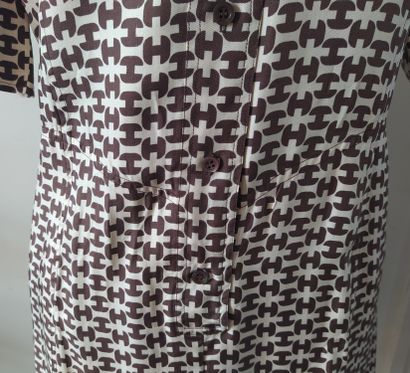  HERMES SPORT 
Shirt dress in silk with brown H pattern on a cream background, short...