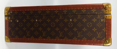  LOUIS VUITTON 
ALZER model suitcase with studded leather lozenge edges, gilt brass...