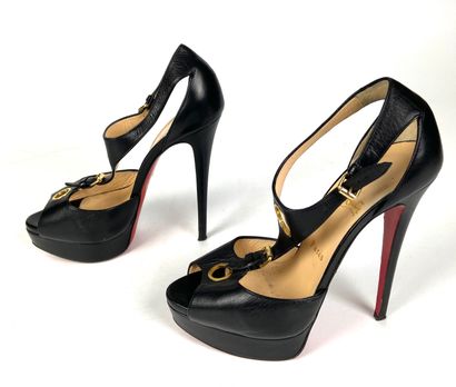 null CHRITIAN LOUBOUTIN 

Pair of black leather platform sandals with straps 

Size...