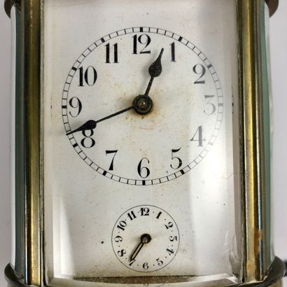 null 
OFFICER'S CLOCK. Oval shaped clock. Apparent mechanism. Alarm clock function....