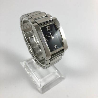 null RECTANGULAR WEAVE. Rectangular steel case. Black dial, applied Roman numerals...