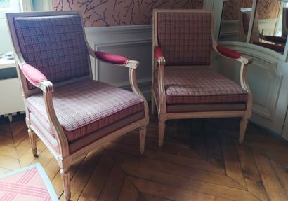 A Pair of square-backed armchairs in cream-coloured...