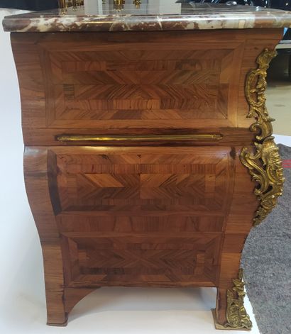 null A tomb-like chest of drawers made of veneer and marquetry in frieze, opening...