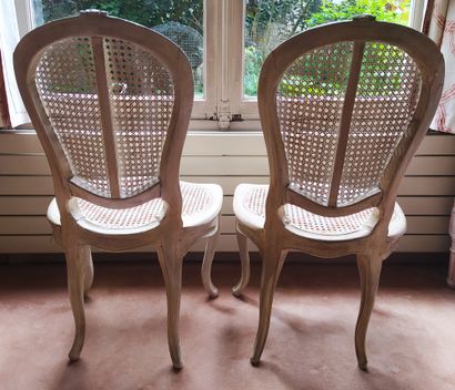 null A Pair of violoné back chairs in cream lacquered wood, moulded and carved with...