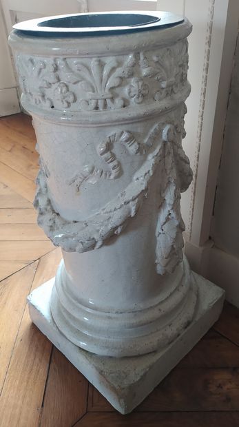  A white cracked ceramic column-shaped stove holder decorated with laurel garlands...