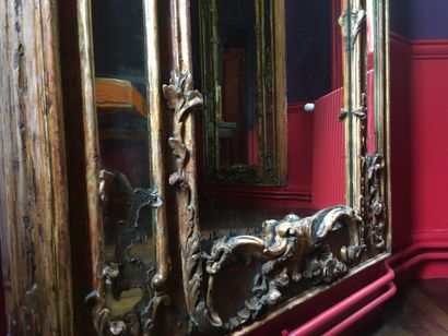  Pair of polychrome and gilded wood mirrors, moulded and carved with flowers, acanthus...