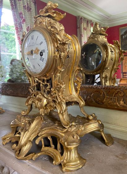  An ormolu, chased and openworked clock decorated with rocaille, flowers and clasps,...