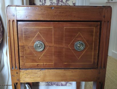 null CHEVET in fruitwood, a large drawer in front with bronze drawer rings, fluted...