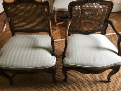  TWO MOVED BACK ARMCHAIRS, in natural wood moulded and carved with pomegranates,...
