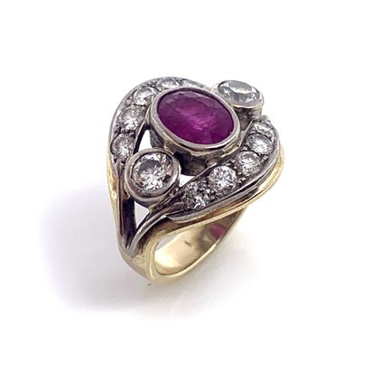 null 
RING

set with an oval ruby (chipped) surrounded by two brilliant-cut diamonds...